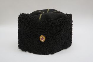 A USSR Russian Soviet Papakha astrakhan fur hat with black top, gold trim, bearing gilt and red