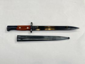 A Russian Mauser bayonet in unissued condition, dated 44, with matching numbered scabbard