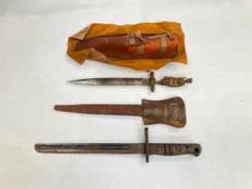 A WWI Chateau Thierry commemorative dagger with leather sheath, a WWI US bayonet (shortened and