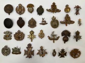 A collection of British Army cap badges, various regiments