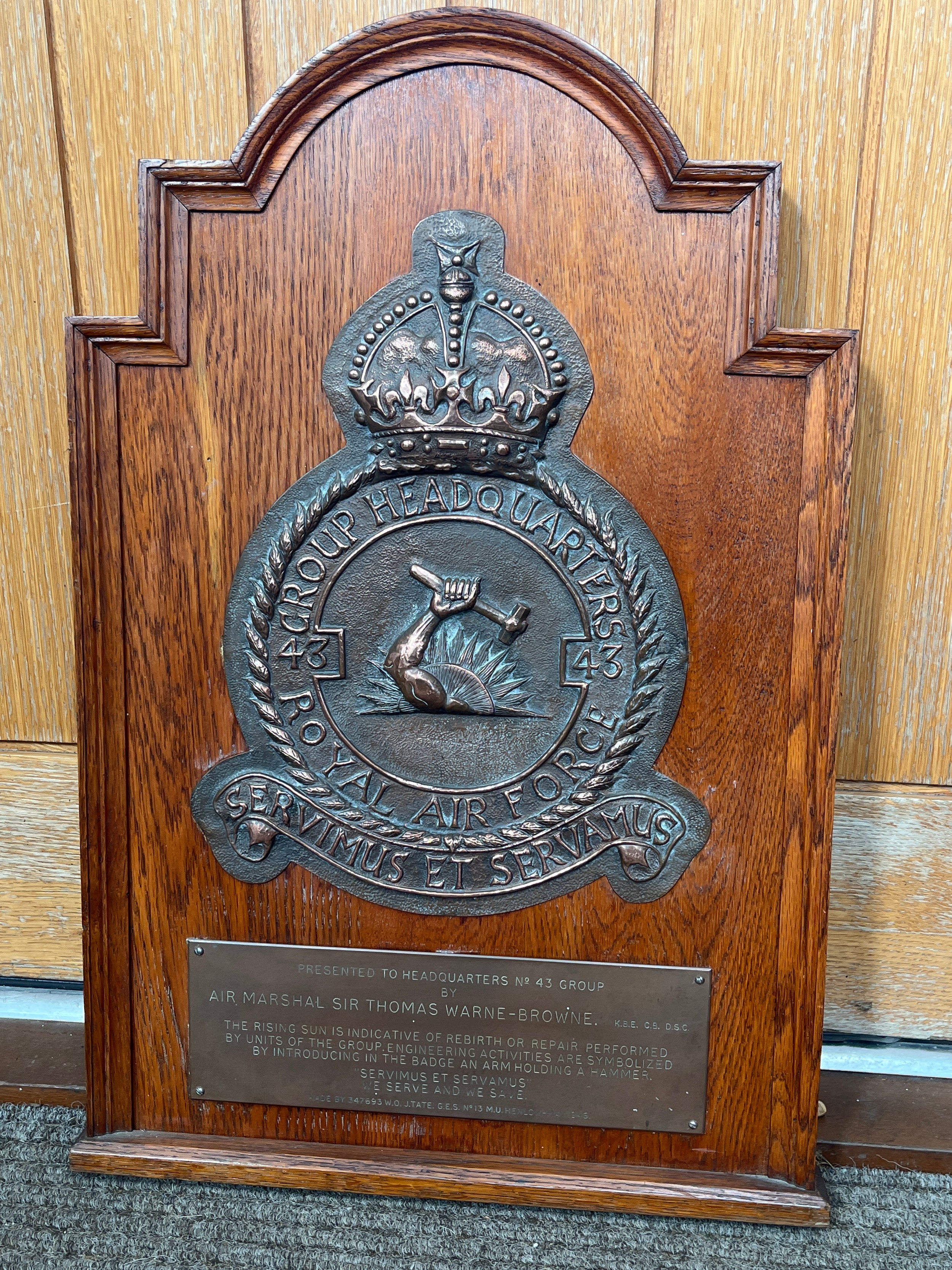 A Group Headquarters No. 43 RAF crest in copper mounted on an oak display, with plaque marked “
