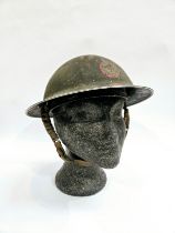 A WWII British helmet, the shell dated 1939 and liner 1938, with traces of original 'AFS IPSWICH'