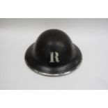 A WWII British Home Front Rescue Party Steel Helmet, black with stencilled white “R” to the centre