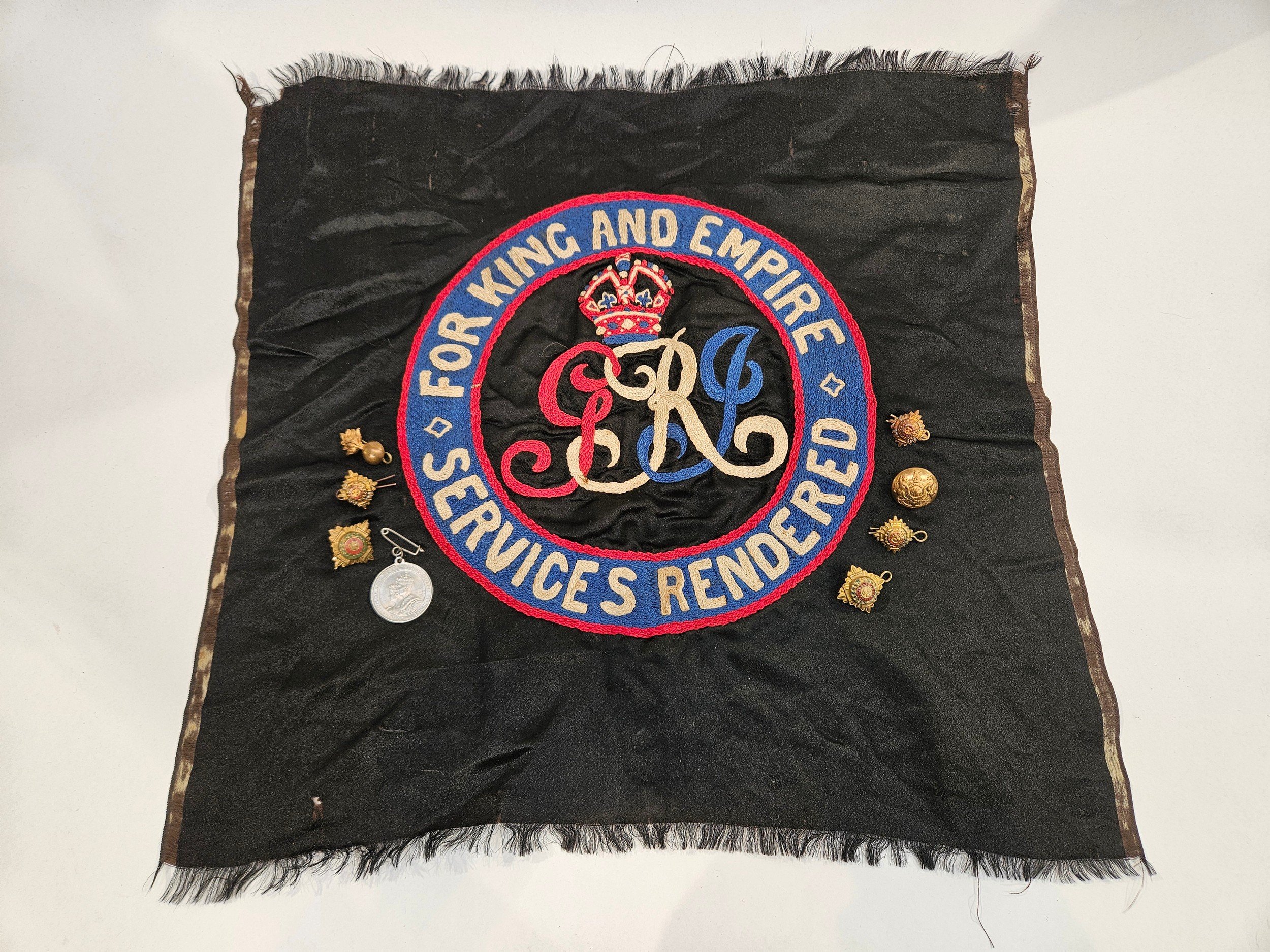 An embroidered silk 'Services Rendered For King And Empire' panel together with a quantity of