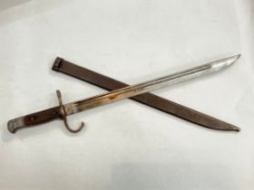 A Japanese sword bayonet 30th Year Type by Moji subplant of Kokura Arsenal, with steel scabbard