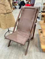 A 19th Century folding campaign chair with studded upholstery