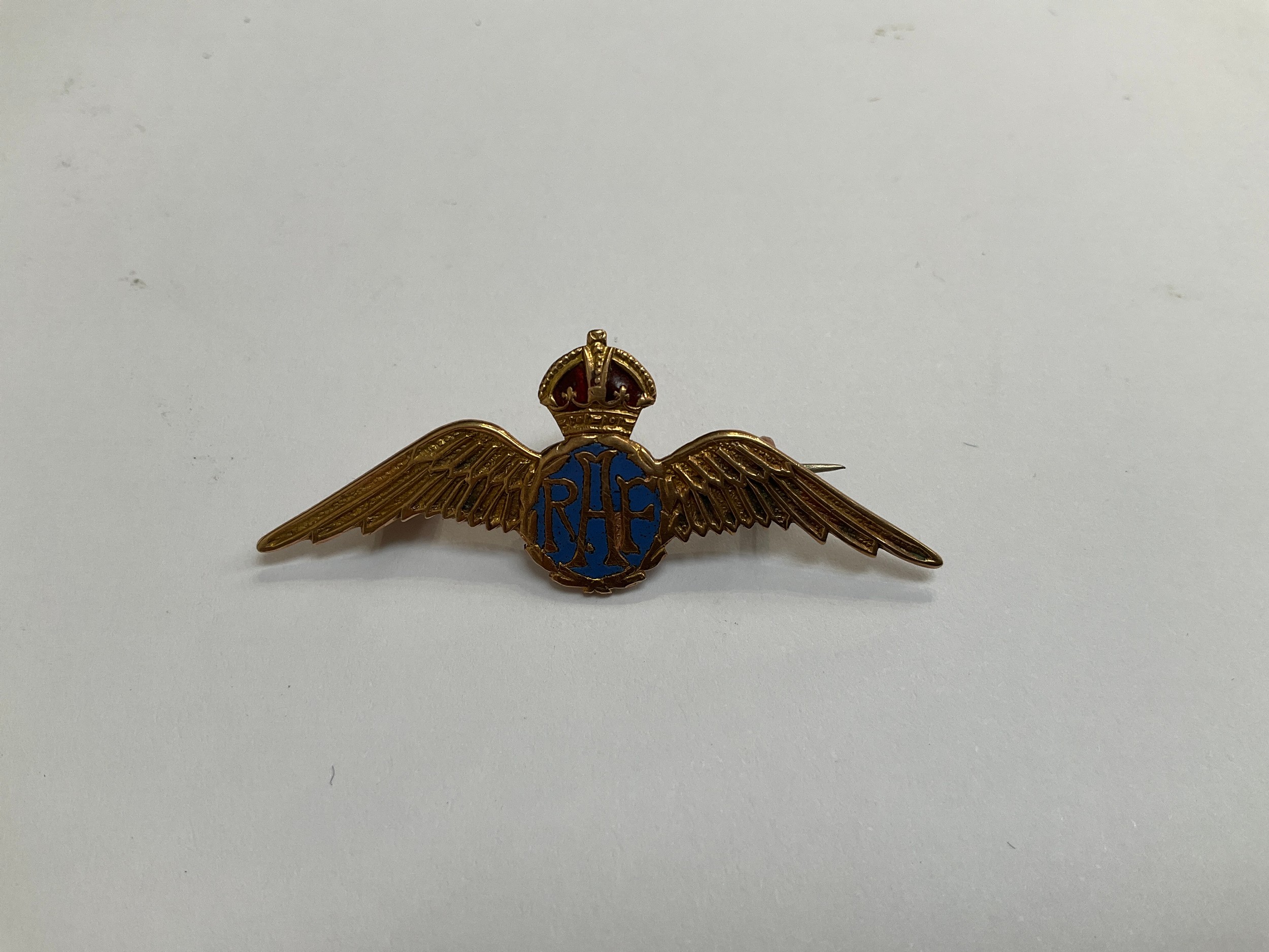 A 9ct gold RAF sweetheart brooch, central blue enamel RAF lettering with red enamel to crown,