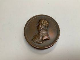 A 19th Century commemorative bronze coin-form box, the obverse cover with side profile of the Duke