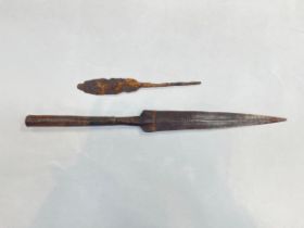 Two spear heads, one in relic condition
