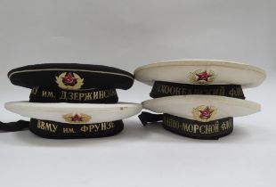 Four USSR Russian Soviet Navy sailor's hats, three white with black tally, the other black with