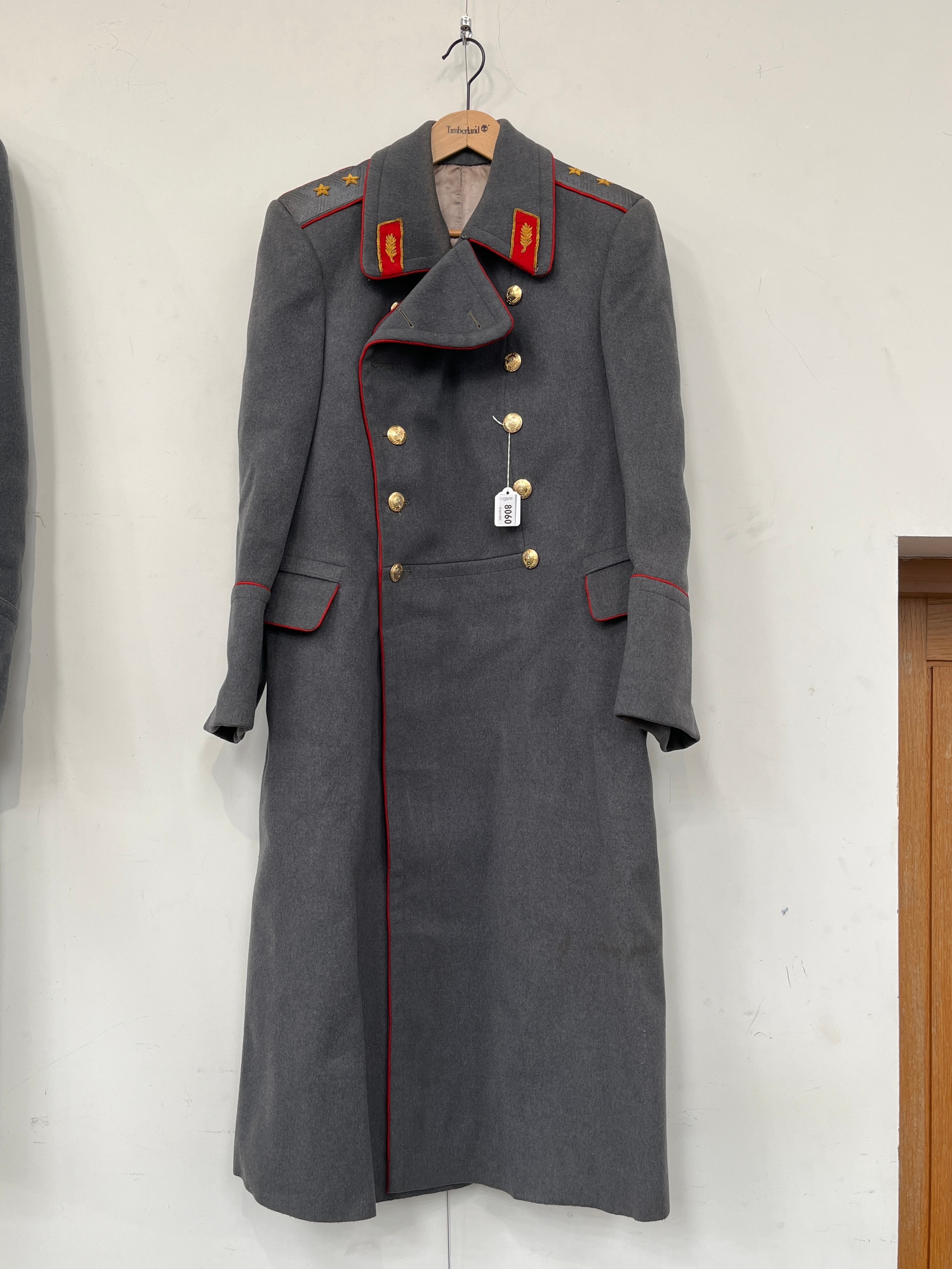 A USSR Russian Soviet army overcoat, grey with red piping and insignia