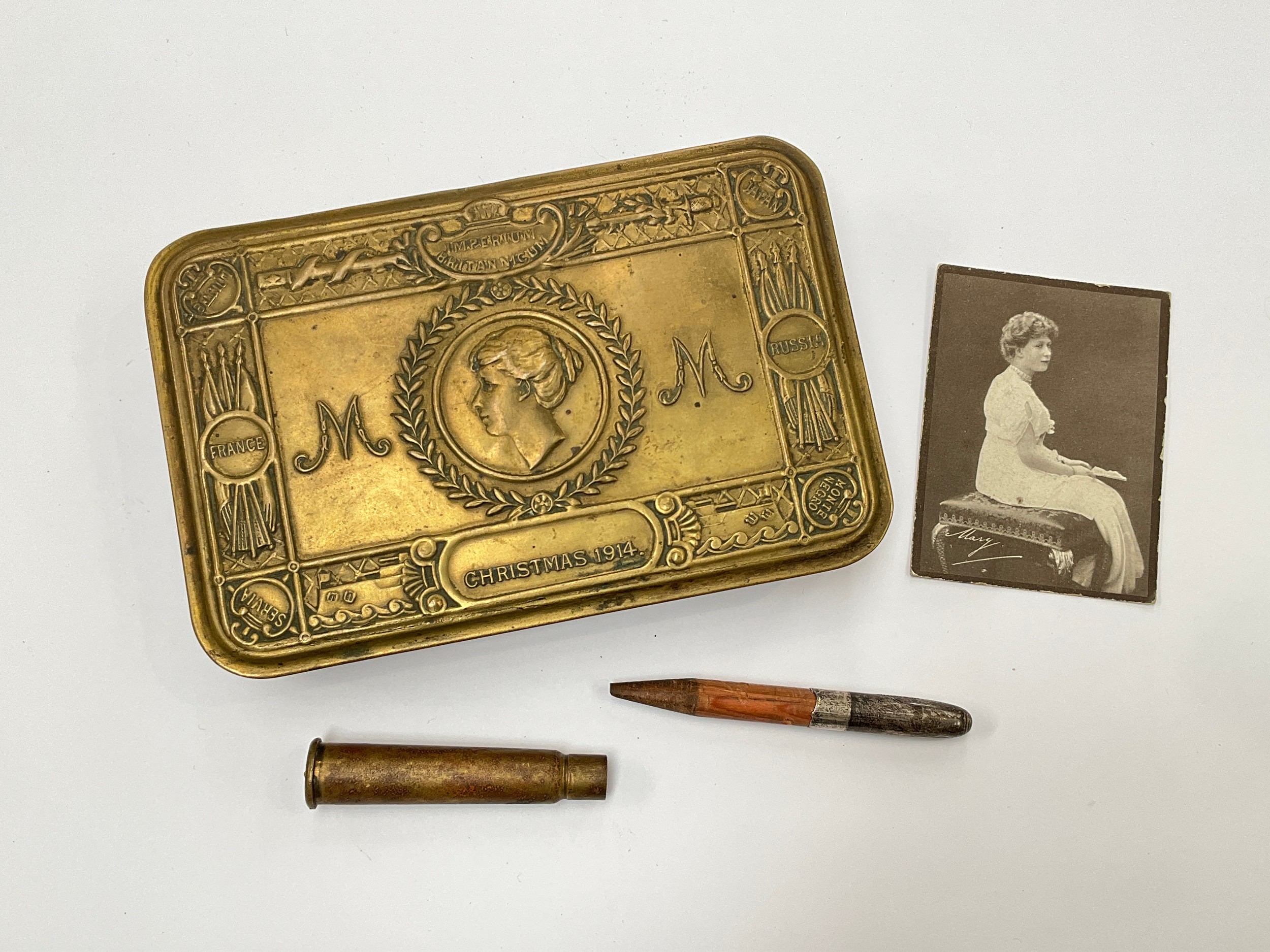 A WWI Christmas 1914 Princess Mary gift tin with bullet pencil and Princess Mary photograph