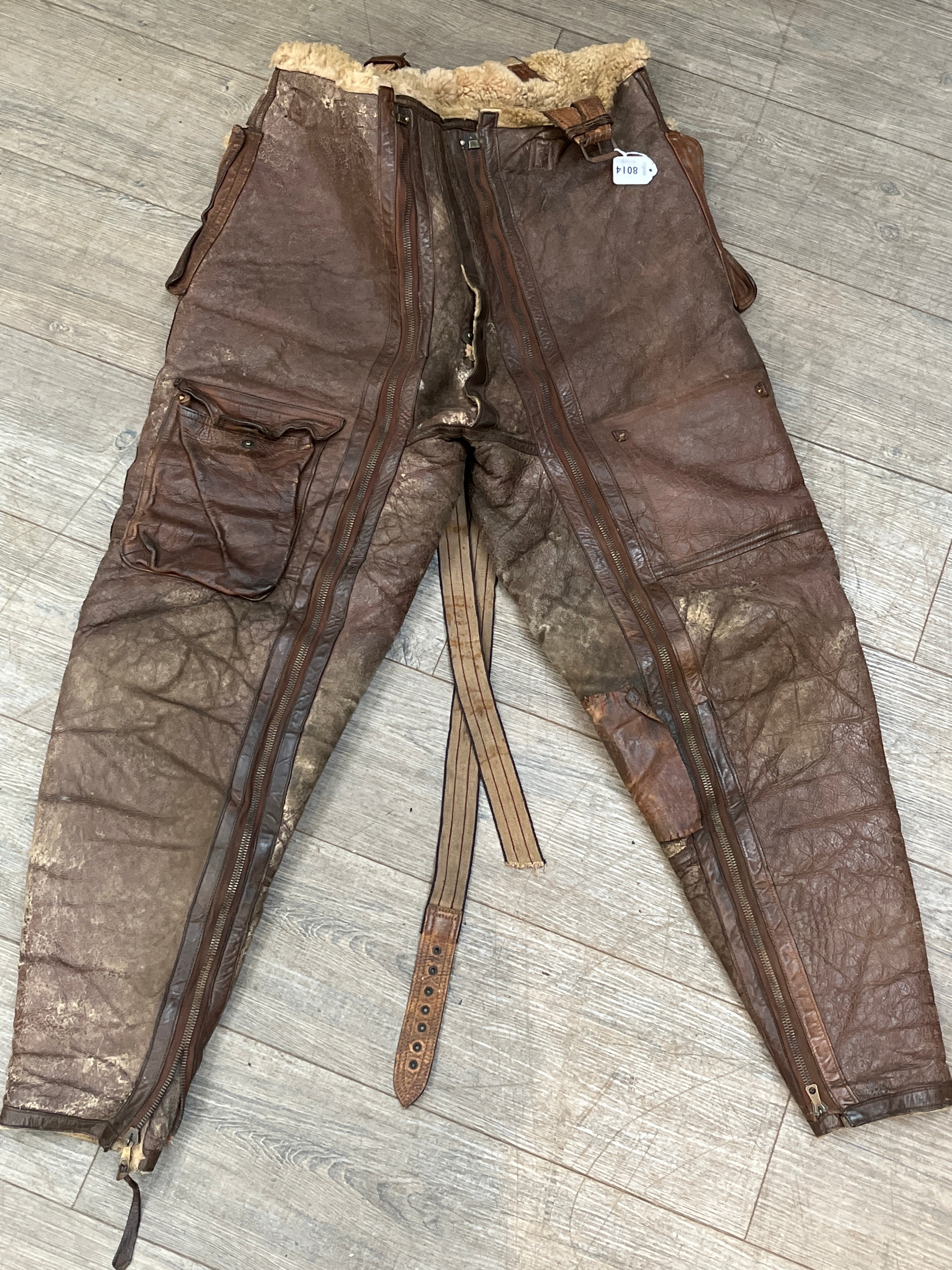 A WWII pair of Irvin sheepskin leggings, the straps marked SGT. E. WILLIAMSON