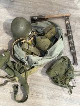 A quantity of US military equipment including webbing pouches and helmet, within a kit bag