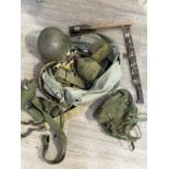 A quantity of US military equipment including webbing pouches and helmet, within a kit bag