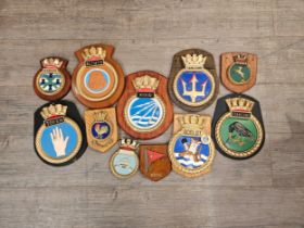 A collection of ship's crests including Token, Active, Portsmouth, Vivid, Starling and Valiant