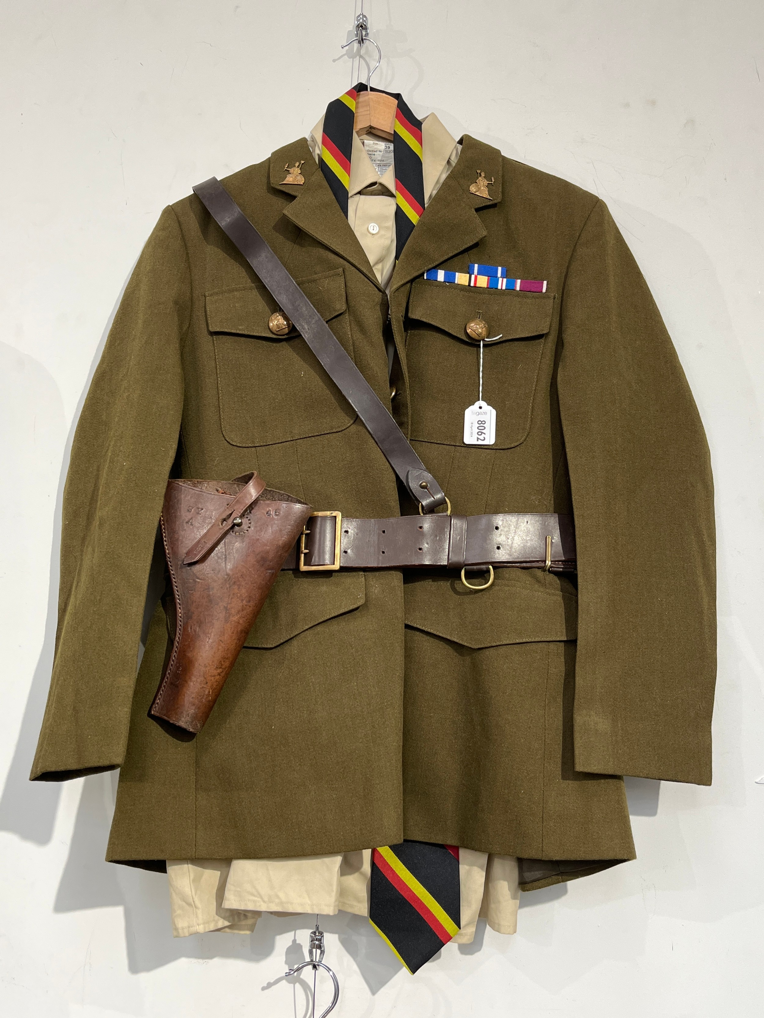 A post-war British Army Service Dress uniform with Norfolk Regiment insignia, together with an