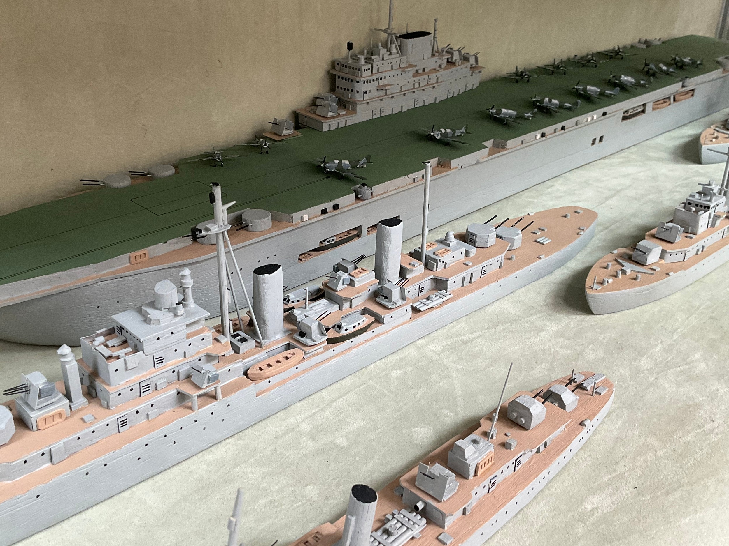 Six handmade battleship models consisting of HMS Victorious, HMS Black Prince, HMS Apollo, HMS