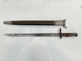 A WWI US 1917 bayonet by Remington, dated 1917, with a flaming grenade stamp, with scabbard