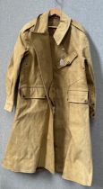A WWII dispatch rider's overcoat by A, & E Bye Ltd, dated 1945 to label, size 8
