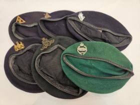 Six various berets with badges including King’s crown Tank Regiment, Royal Artillery, RASC, On War