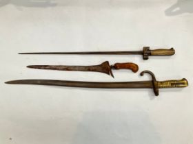 A 19th Century French Chassepot sabre bayonet, epee lebel bayonet and a relic kris (3)