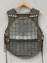 Scarce WWI Franco-British body armour, the khaki body supports externally fitted armoured sections