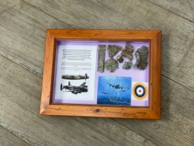 A collection of WWII Lancaster aircraft crash relics, D5836, displayed within a glazed frame with