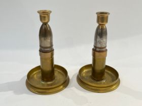 A pair of WWI Trench Art candlesticks crafted from shells and shell case base, various markings