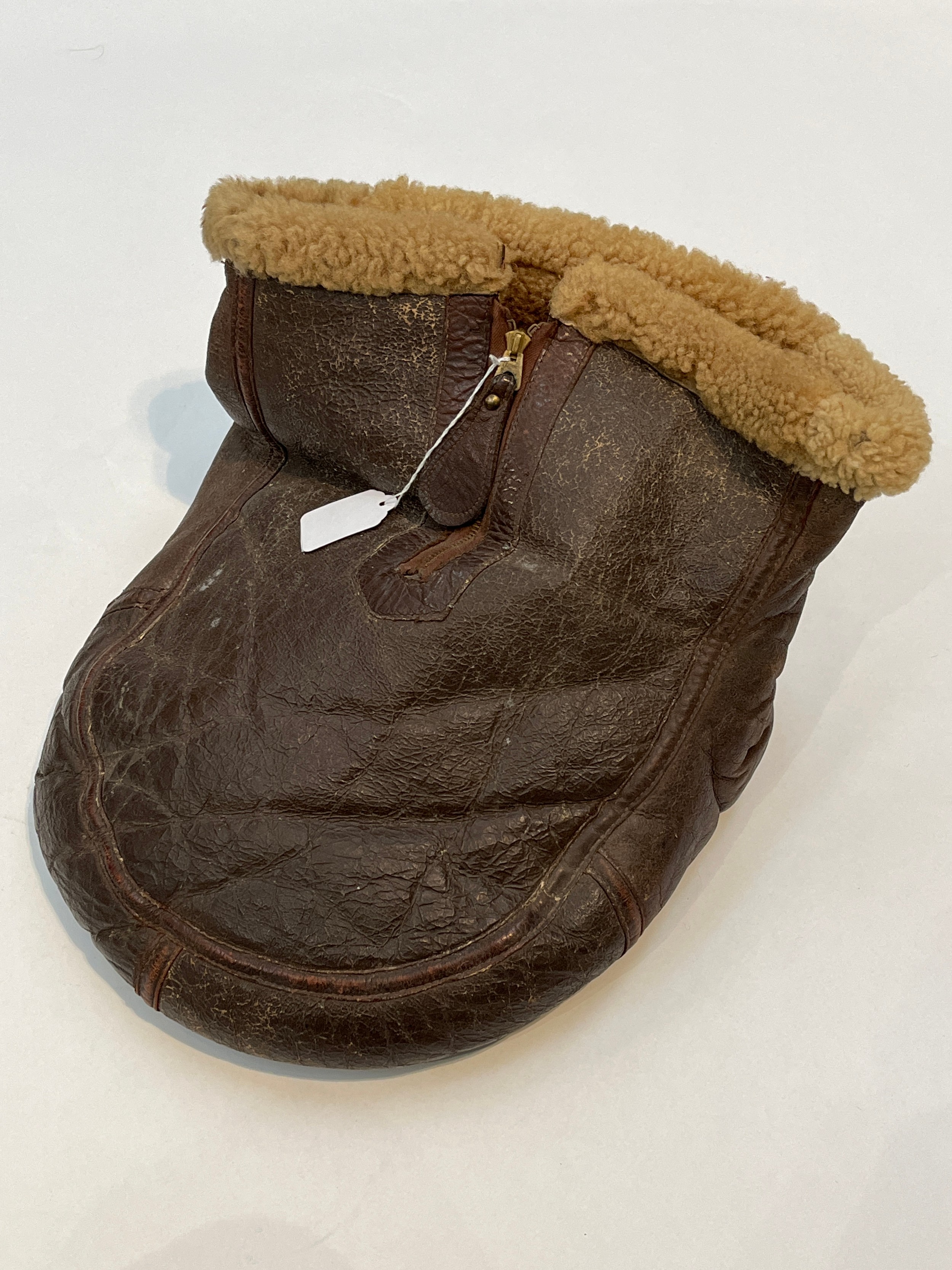 A scarce WWII RAF foot warmer, sheepskin and leather, possibly Irvin