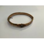 A German sweetheart bracelet with applied WWI Iron Cross detail, within a brown leather pouch