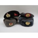 Two Russian Soviet USSR ushanka winter service hats together with two berets (4)