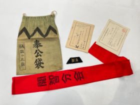 A quantity of Japanese soldier's personal items including documents, arm band etc, varying ages