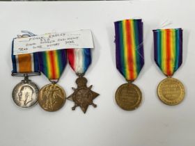 A WWI 1915 star medal trio named to 3300 PTE. F. RAPLEY R. SUSS. R., together with two Victory