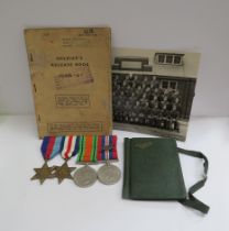 A group of WWII medals, documents and diary etc to WOII M. DUTTON MID. REME