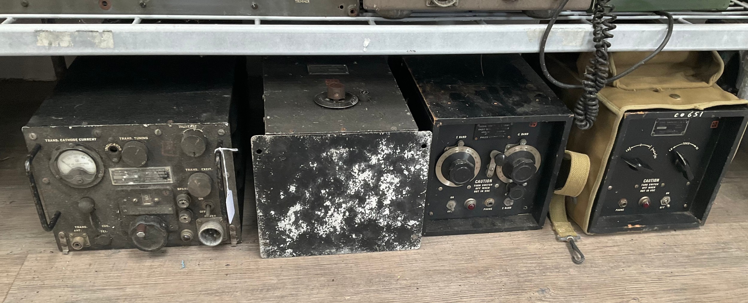 Four pieces of equipment including Signal Corps Transmitter RT-45/ARQ-1, Antenna Tuning Unit BC-