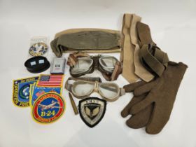 A box of miscellaneous militaria including goggles