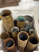 A box of WWI and WWII brass shell cases