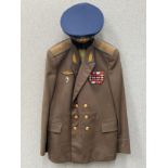 A Russian USSR Soviet Air Force officer’s jacket together with a praised visor cap, blue piping