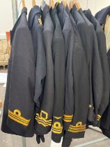 Eight post-war Royal Navy jackets together with a battledress jacket, some with trousers