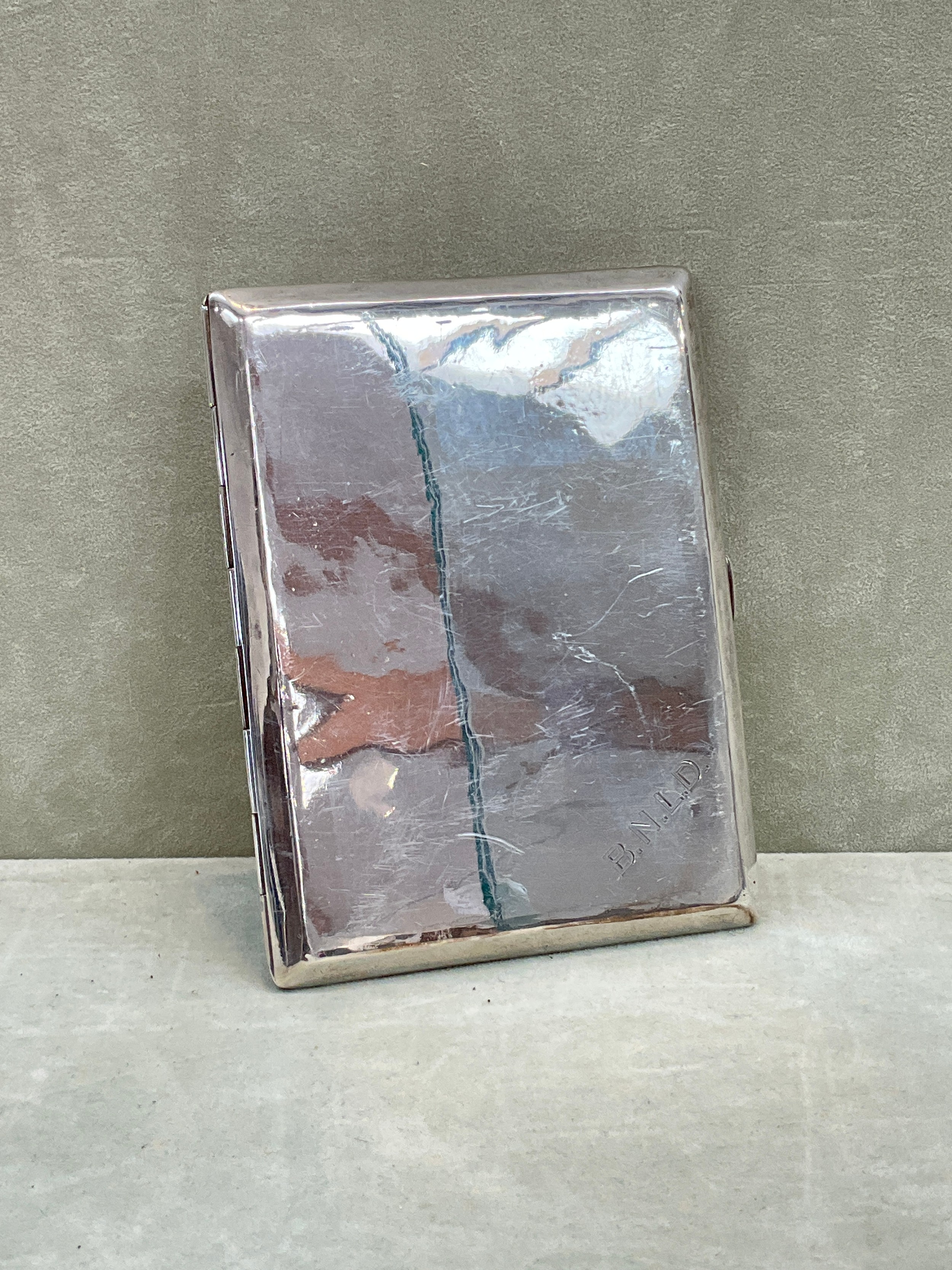 A William Hutton & Sons Ltd. silver cigarette case, plain with initials to corner, inscribed to