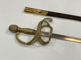 A Whites of London rapier sword, brass rope design hilt, tapering blade, with leather and brass