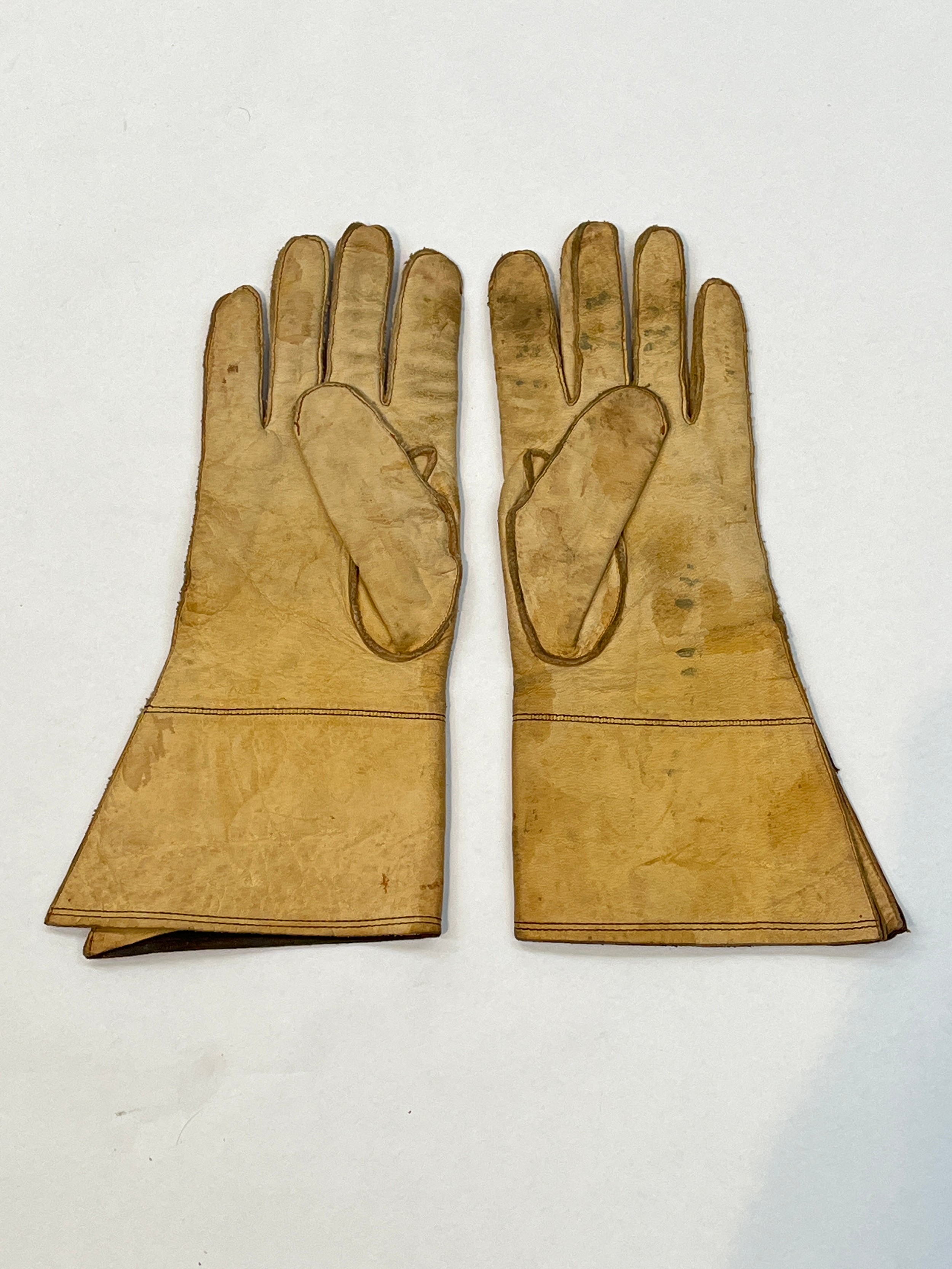 A pair of WWII British driver's leather gloves, maker marked Frank Bryan Ltd and dated 1943