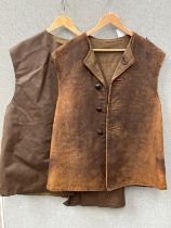 A WWII 1945 dated No. 2 leather jerkin, size No. 1, some wear, together with another dated 1961 (2)