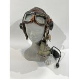 A WWII British RAF C-Type leather flying helmet together with goggles and respirator