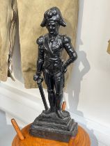 A cast iron door stop in the form of Emperor Napoleon, black painted