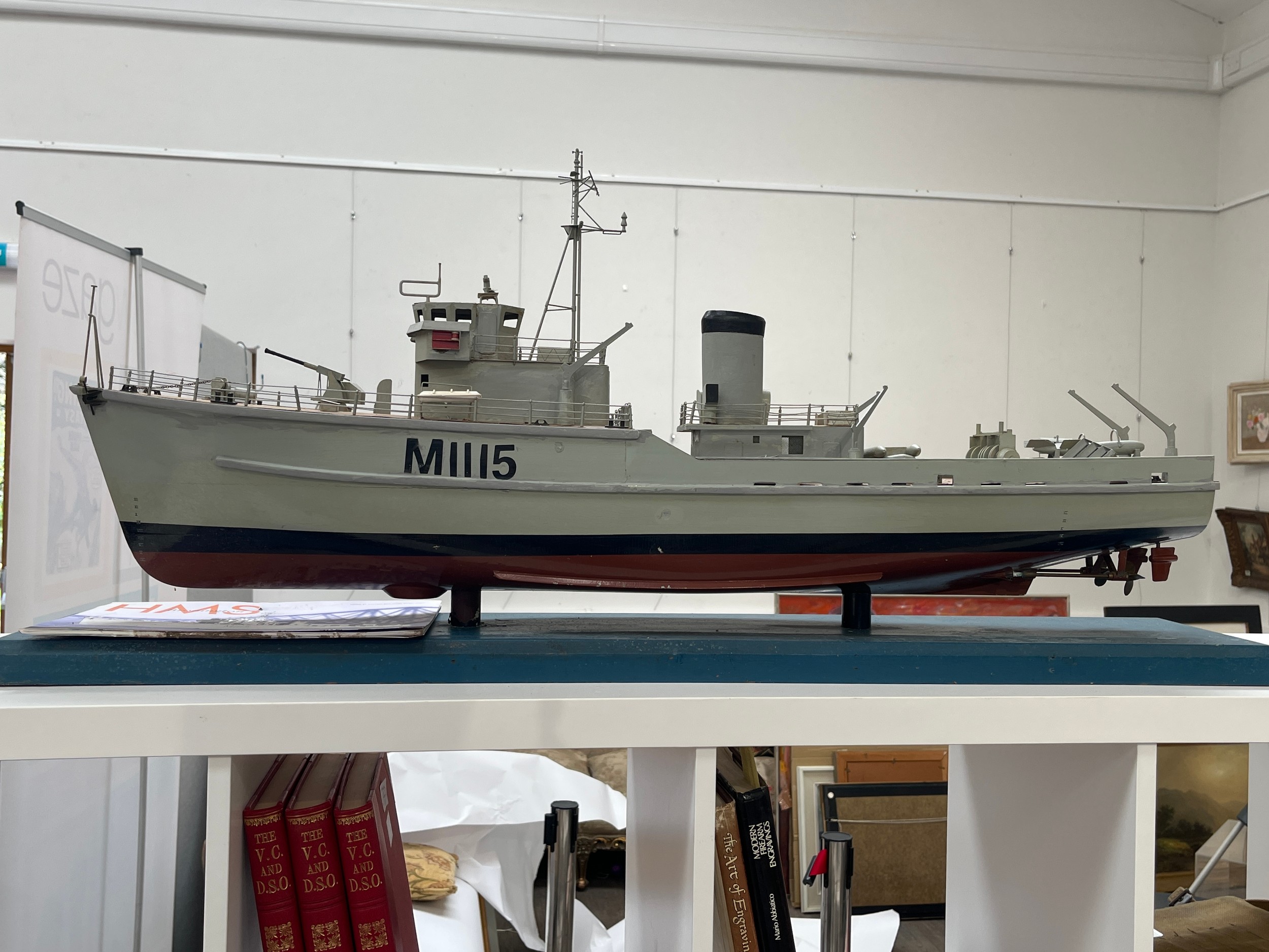 A model of HMS Bronington together with booklet, the vessel measures approximately 1m in length