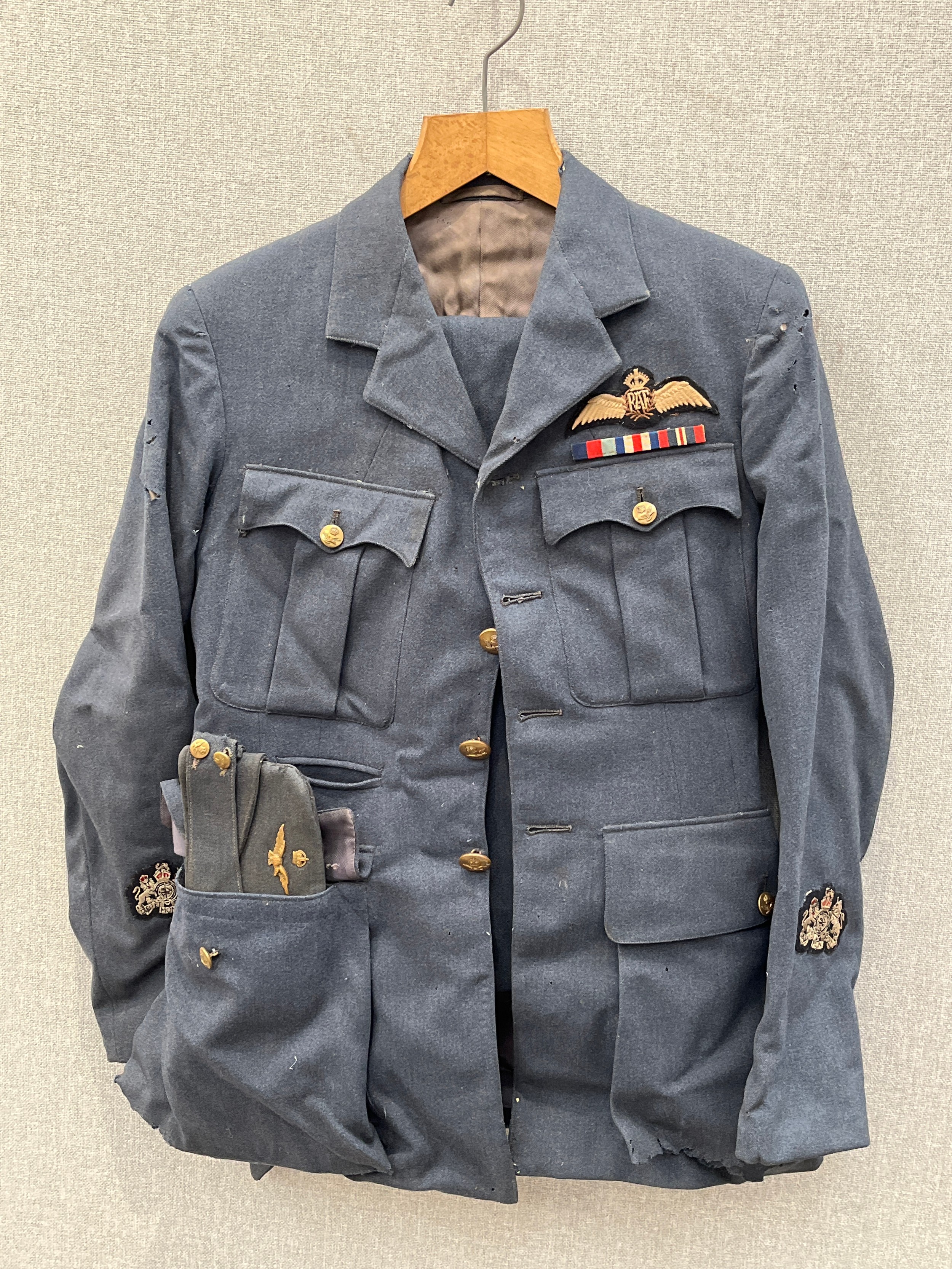 A WWII RAF 1943 dated Warrant Officer pilot's uniform consisting of jacket, trousers, side hat, C-