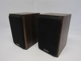A pair of Monitor Audio Bronze BX1 bookshelf speakers, together with a pair of B Tech wall brackets