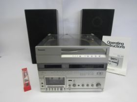 A Panasonic SG-165 integrated hi-fi stereo audio system with speakers
